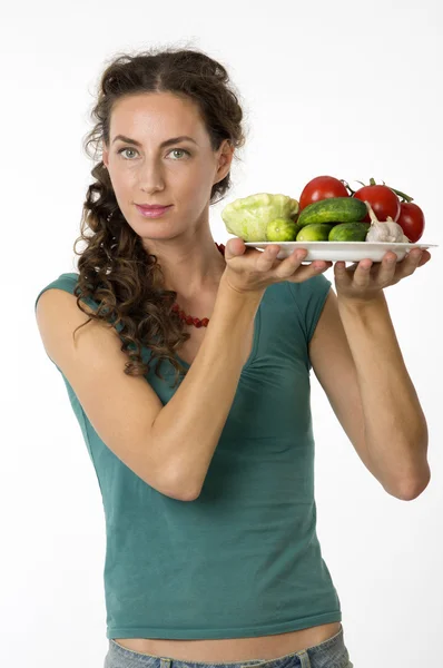 Portrait of a young beautiful woman with vegetables Stock Image