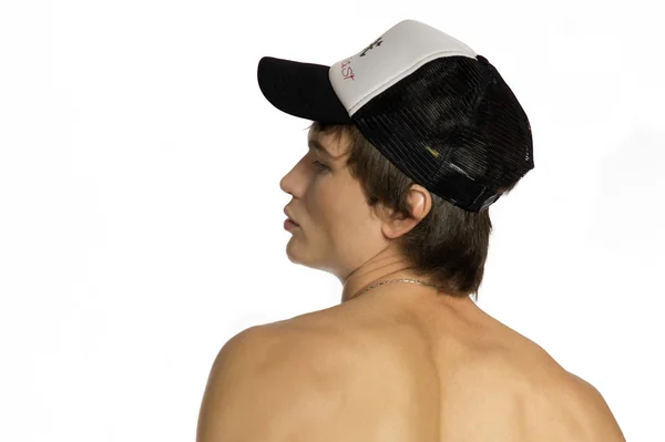 裸の腰若い運動選手はスポーティなキャップ — ストック写真