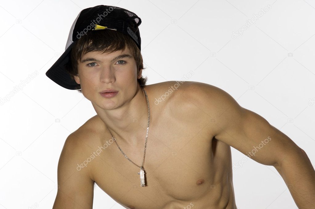 Naked waist young athlete with sporty cap
