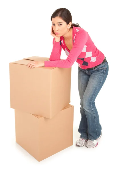 Tired Looking Woman Leaning on Boxes — Stock Photo, Image