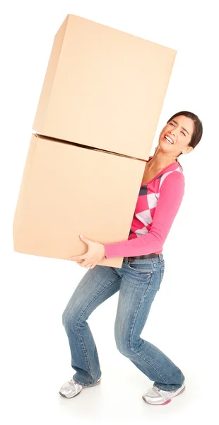 Mujer dolorosamente cargando cajas Imagen de archivo