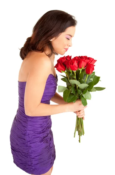 Žena držící a vůně růže — Stock fotografie