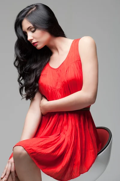 Gorgeous brunette on chair — Stock Photo, Image
