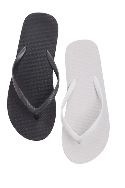 Paar van zwart en wit slippers — Stockfoto