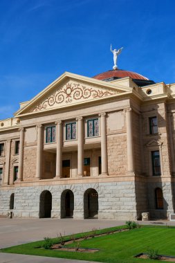 Arizona State Capital with pillars, copper dome, angel and bright blue sky clipart