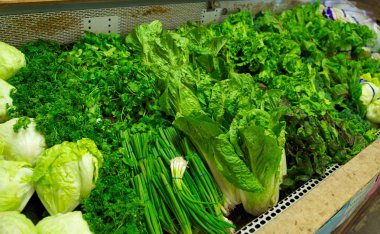 Bright Green Produce in Grocery Store Bin clipart