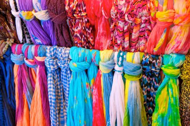 Brightly Colored Scarves on Rack clipart