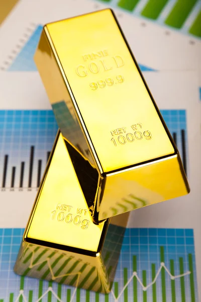 Gold Ingot on a Chart — Stock Photo, Image