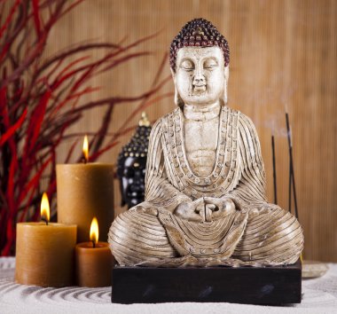 Buddha with candle clipart