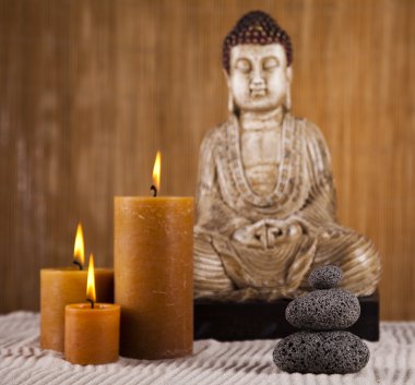 Buddha with candle clipart