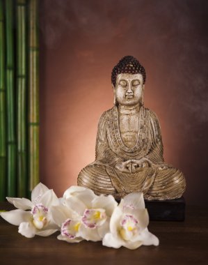 Buddha statue with orchid flower clipart