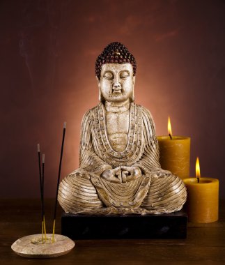 Buddha with candle clipart