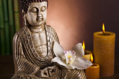 Buddha with candle clipart