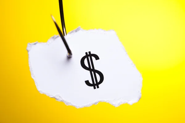 Dollar sign on piece of paper on hook — Stock Photo, Image