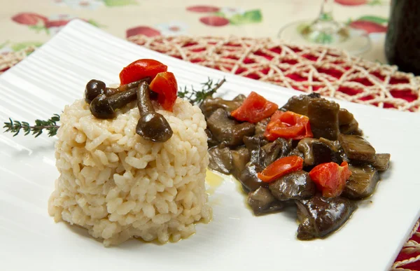 stock image Risotto with tomaotes and mushrooms