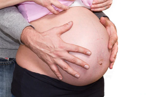 怀孕的女人抱着肚子 — 图库照片