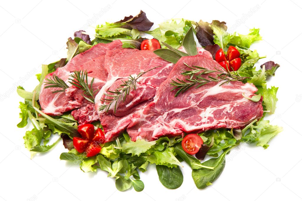 Sliced raw meat with salad