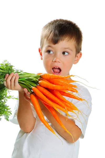 Niño con zanahorias —  Fotos de Stock