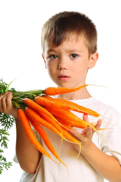Chłopiec z marchewką — Zdjęcie stockowe