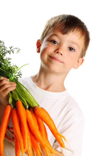 Gutt med gulrøtter – stockfoto