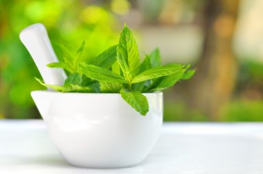Mortar and mint leaves clipart