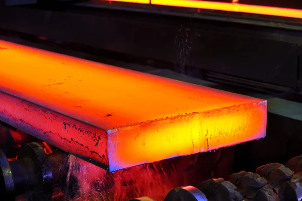 Hot steel on conveyor — Stock Photo, Image