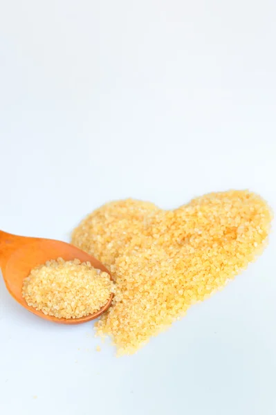 Lžíce překypující hnědého cukru — Stock fotografie