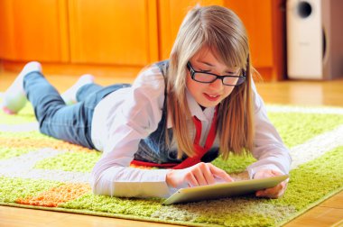 Girl holding a touchpad tablet clipart