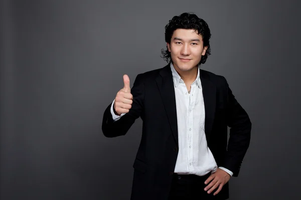 Asiático hombre celebración de la mano positivo —  Fotos de Stock