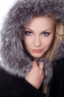 Young woman with a fur hood