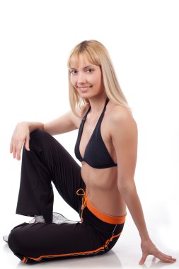 Spor kadın oturup beyaz