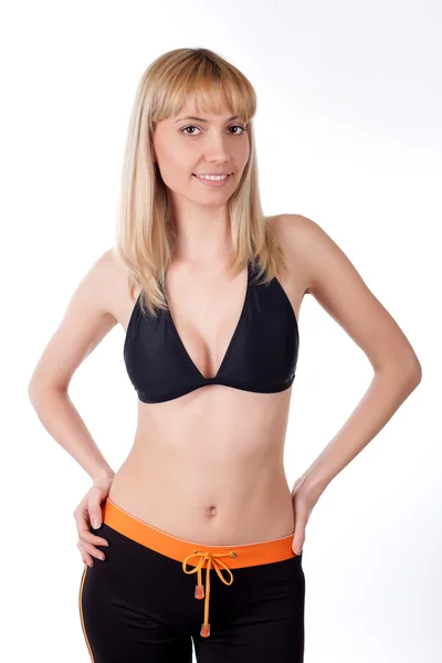 Žena fitness instruktor na bílé — Stock fotografie
