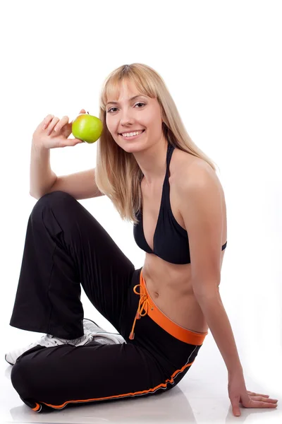 Deporte de mujer con manzana verde — Foto de Stock