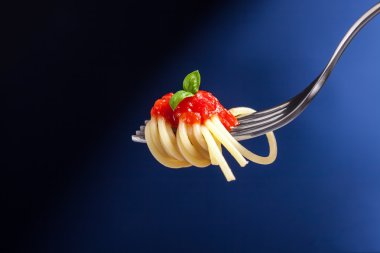 Spaghetti with Tomato Sauce wrapped on a fork clipart