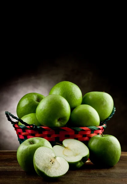 Green Apples inside a basket — Stock Photo, Image