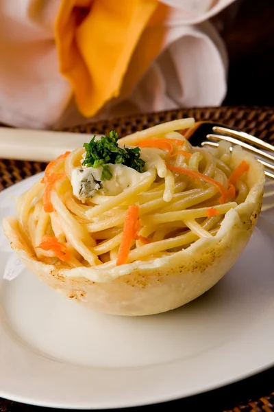 Pasta with Gorgonzola sauce inside parmesan waffle — Stock Photo, Image
