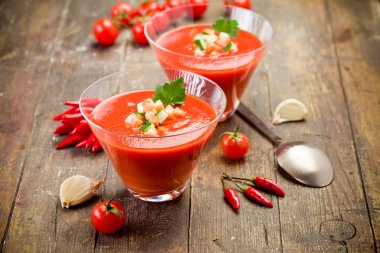 Gazpacho on wooden table clipart