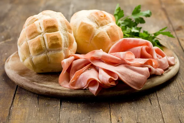 Mortadella with Bread on Chopping board — Stock Photo, Image