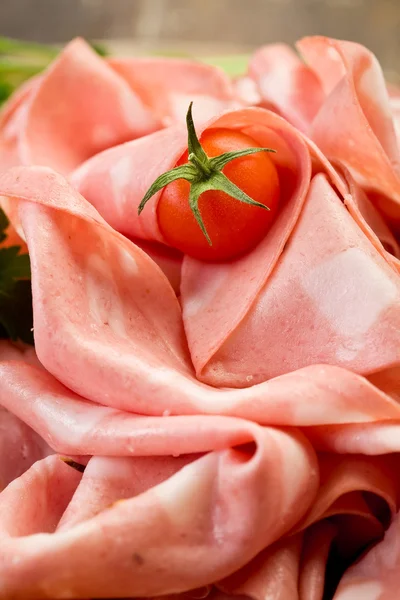Mortadella slices with red pepper — Stock Photo, Image