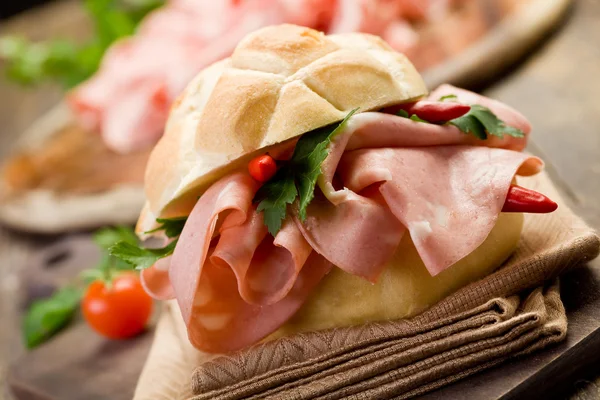 Sandwich with Mortadella and red peppers — Stock Photo, Image