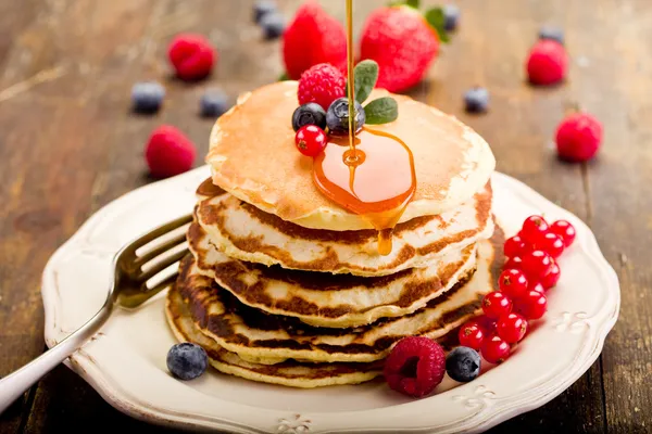Pancakes on wooden table — Stock Photo, Image