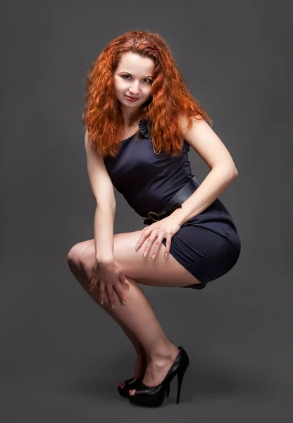 Redhead girl posing in studio — Stock Photo, Image