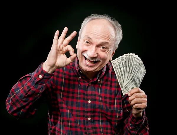 Ηλικιωμένος άνδρας προβολή ανεμιστήρα χρήματα — Φωτογραφία Αρχείου