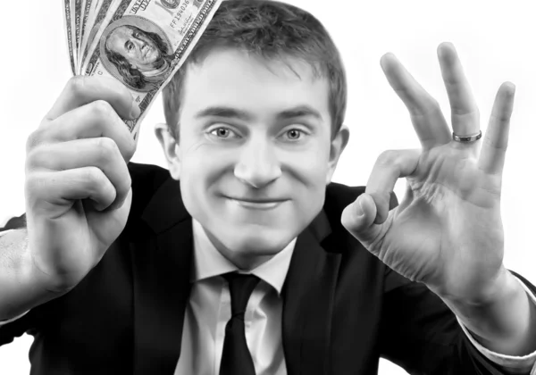 Businessman showing fan of money and sign OK — Stock Photo, Image