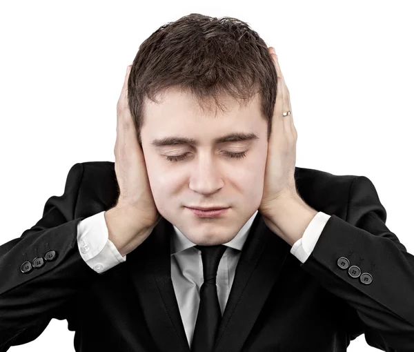 Young businessman with ears closed by hands — Stock Photo, Image
