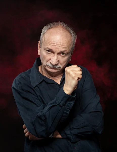 Senior man in black shirt — Stock Photo, Image