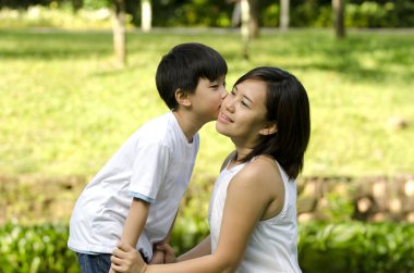 Son kissing mother clipart