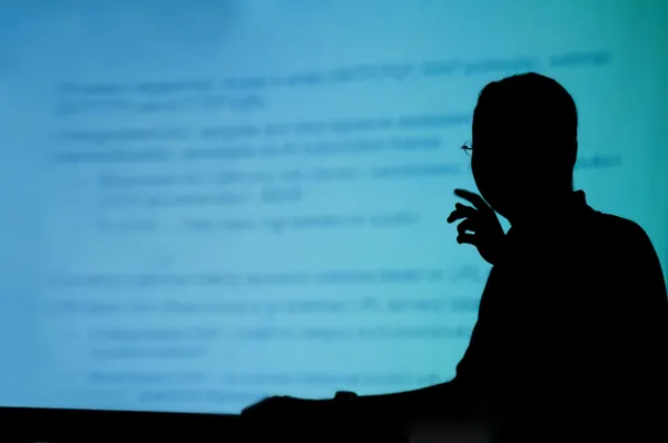 Silhouette of a man doing presentation — Stock Photo, Image