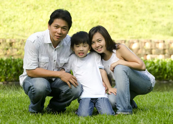 Asian family with green background — Stock Photo, Image