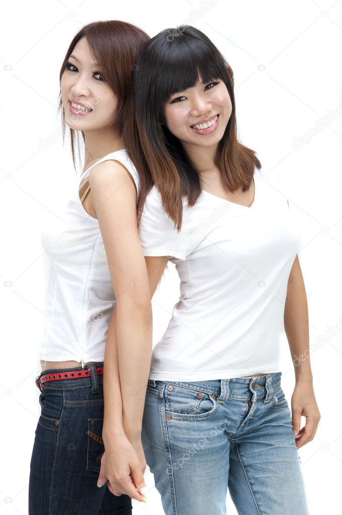 Two cheerful Asian girls isolated on white background.